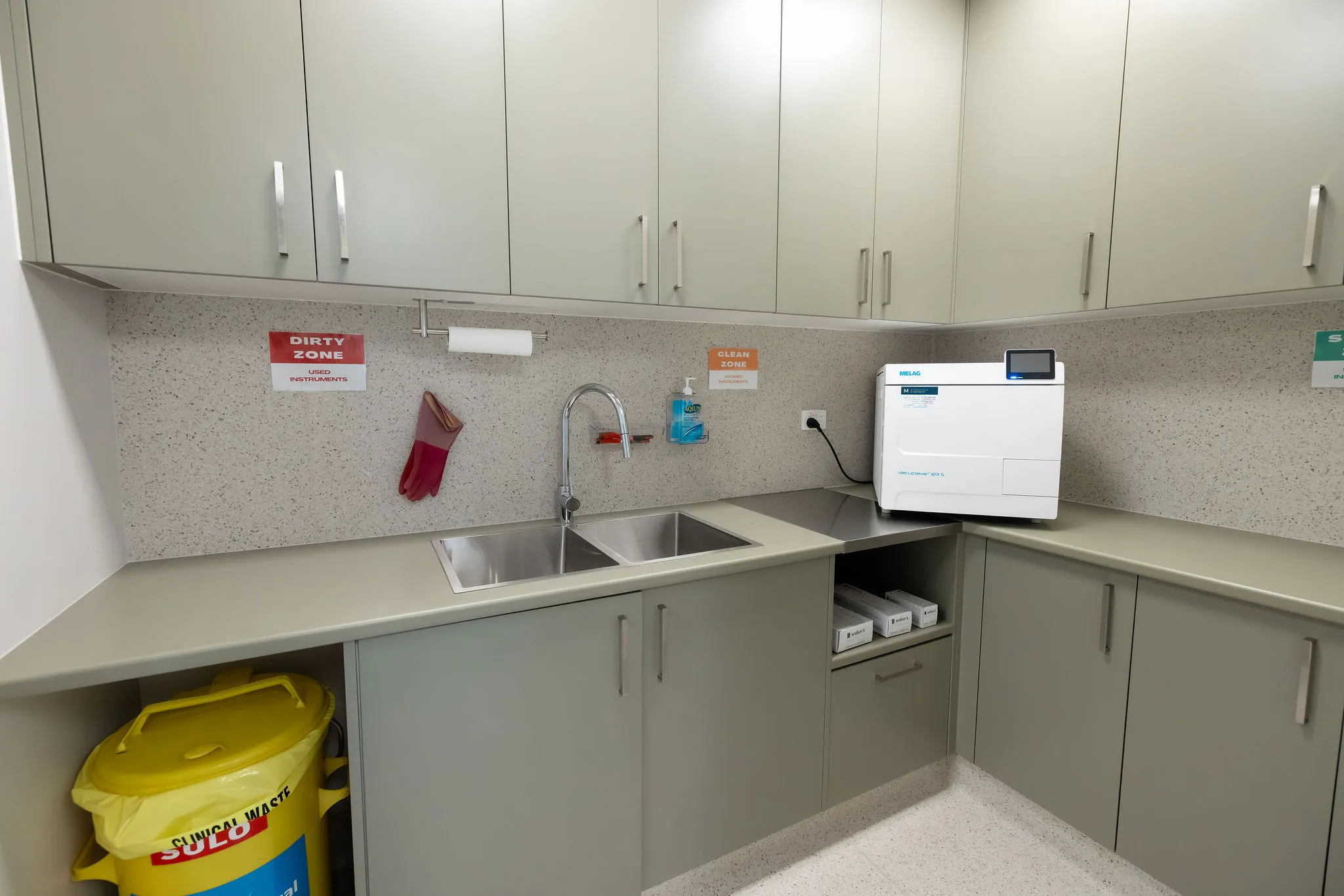 sterilization room at austral podiatry featuring melag autoclave sink and clean zone counters at podiatry clinic in austral, nsw