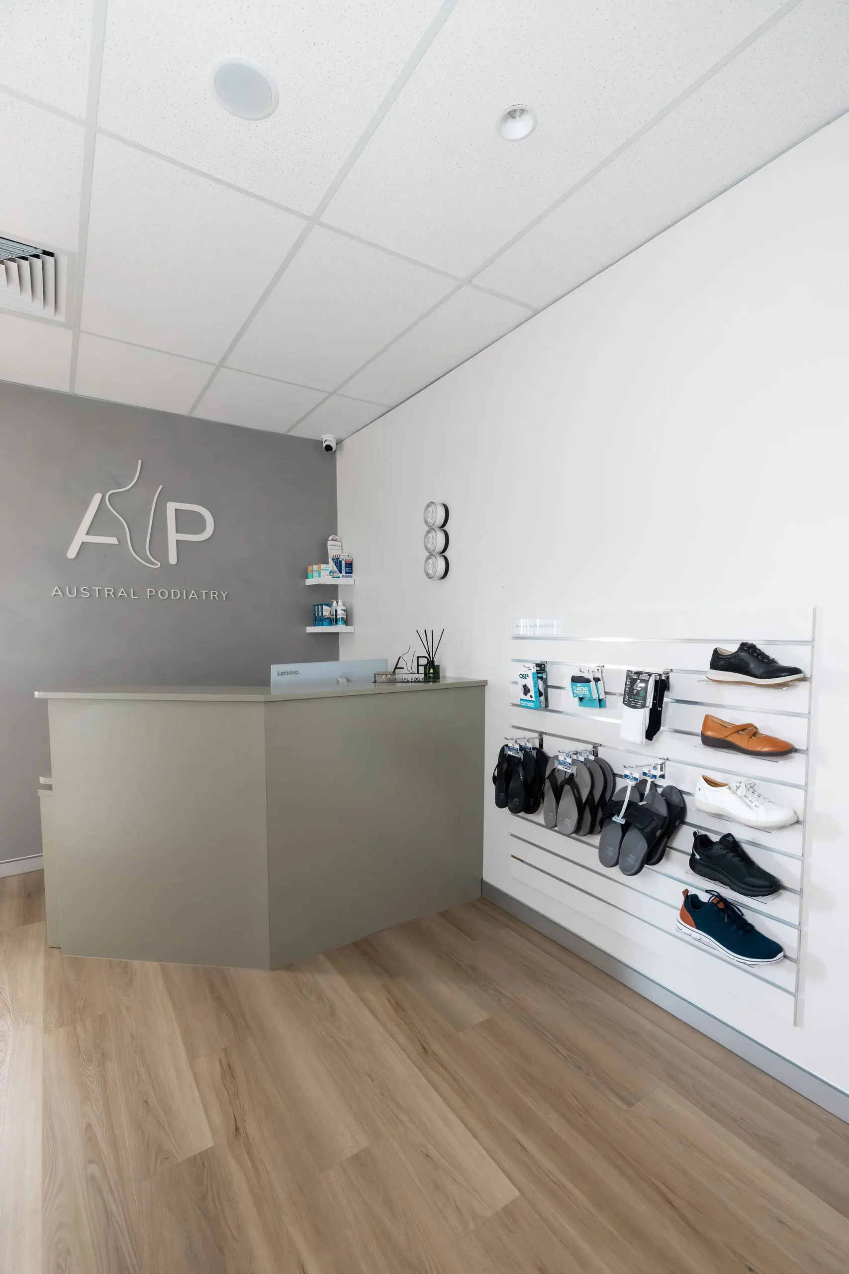 wide view of austral podiatry reception desk and podiatric footwear display in austral, nsw